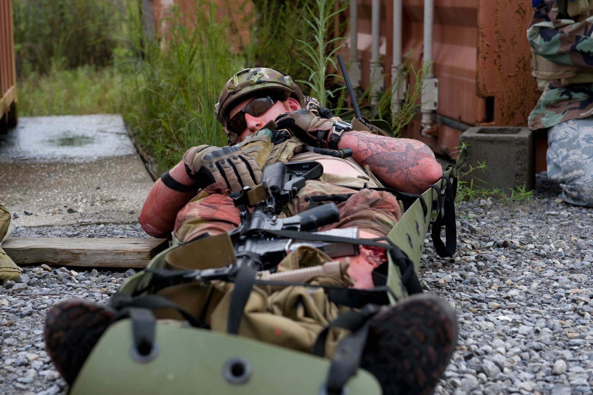 A U.S. Air Force pararescueman plays a casualty during a training exercise on Eglin Range, Fla., Aug. 21, 2012. The pararescueman was portraying a casualty killed in action during a training exercise.(U.S. Air Force Photo/ Staff Sgt. John Bainter)