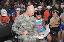 Mya Collins, 11, and her legal guardian, Senior Airman H. Brooks Viel III, a military training instructor with the 322nd Training Squadron, read their “deployment orders” prior to deploying to Camp Justice Aug. 10. Operation Junior Expeditionary Team, commonly called Operation JET, is a one-day mock deployment event, which gives military children insight to what their parents experience during actual deployments.
active-duty Airmen in different fields to gain an understanding of career responsibilities and knowledge of daily Air Force operations, and to interact with enlisted members. (U.S. Air Force photo/Alan Boedeker)