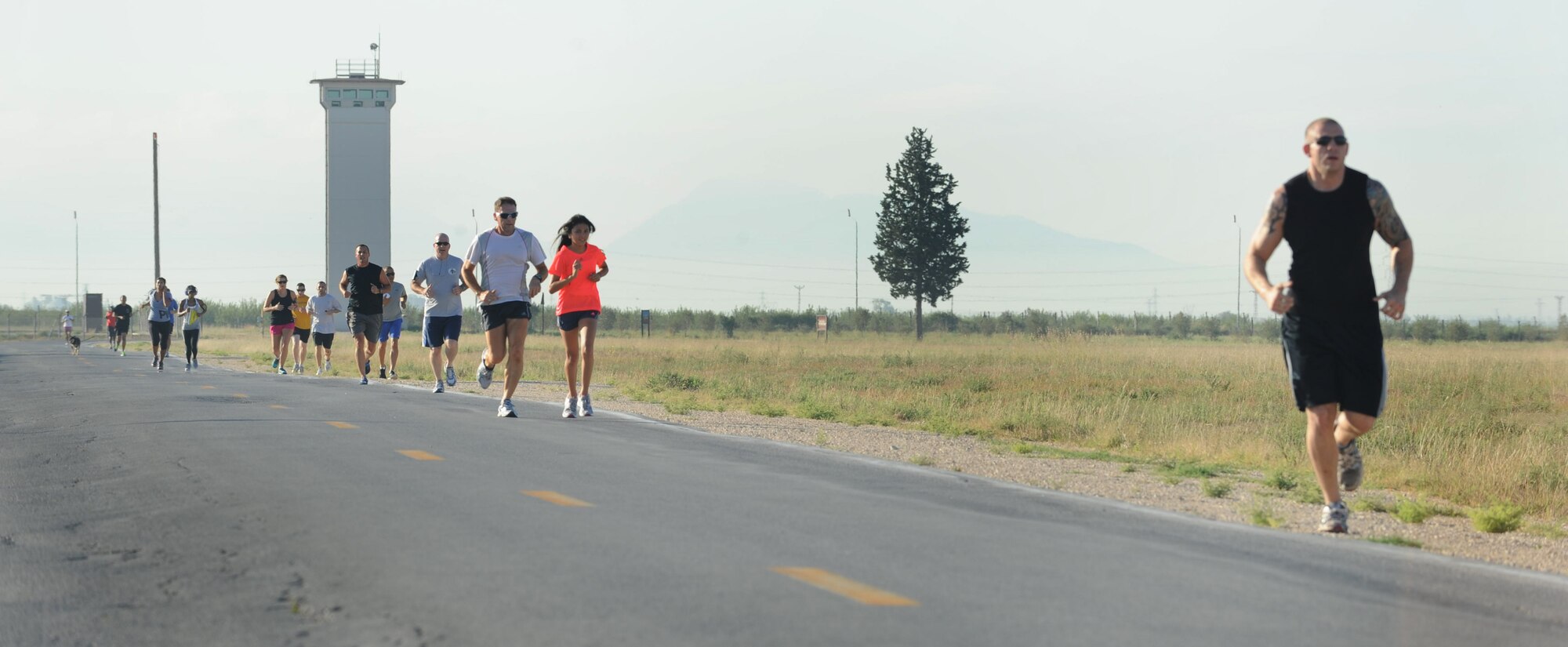 Airmen of Team Incirlik participate in the Airman Leadership School Olympics Aug. 24, 2012, at Incirlik Air Base, Turkey. The event began with a 2.2 mile run, followed by 3-on-3 basketball and volleyball tournaments. (U.S. Air Force photo by Senior Airman Anthony Sanchelli/Released)
