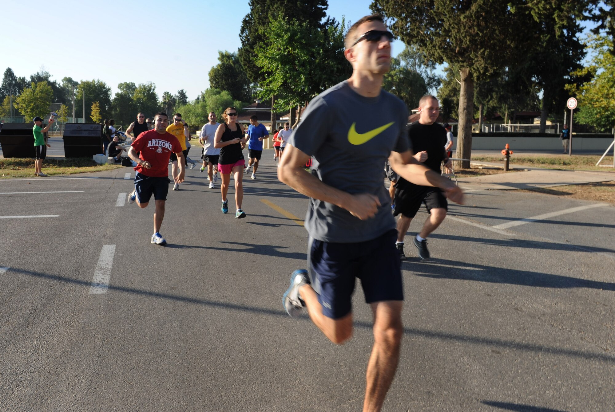 Airmen of Team Incirlik participate in the Airman Leadership School Olympics Aug. 24, 2012, at Incirlik Air Base, Turkey. The event began with a 2.2 mile run, followed by 3-on-3 basketball and volleyball tournaments. Joshua Neate, 39th Communications Squadron, front, placed first in the run for males with a time of 13 minutes and 22 seconds. (U.S. Air Force photo by Senior Airman Anthony Sanchelli/Released)
