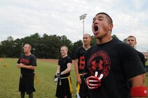 U.S. Air Force Staff Sgt. Chana Lawlor, 4th Logistics Readiness Squadron traffic management office representative, cheers on teammates during a flag football game on Seymour Johnson Air Force Base, N.C., Aug. 21, 2012. Many members of Team Seymour came out to support their fellow wingmen during their second game of the season. (U.S. Air Force photo/Airman 1st Class Aubrey Robinson/Released)