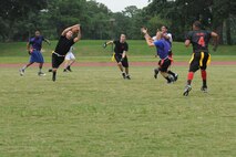 U.S. Air Force Airman Noah Lazurka, 4th Logistics Readiness Squadron fuels apprentice, catches a football during a flag football game on Seymour Johnson Air Force Base, N.C., Aug. 21, 2012. Members of the 4th LRS team practice for approximately an hour and a half on Tuesdays and Thursdays throughout the season in hopes of maintaining their current title as base champs. (U.S. Air Force photo/Airman 1st Class Aubrey Robinson/Released)