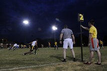 U.S. Air Force Airmen assigned to the 4th Aircraft Maintenance and Comptroller Squadrons play flag football on Seymour Johnson Air Force Base, N.C., Aug. 20, 2012. The 4th AMXS team won 13-12 with a one point conversion on a tipped pass. (U.S. Air Force photo/Airman 1st Class Aubrey Robinson/Released)