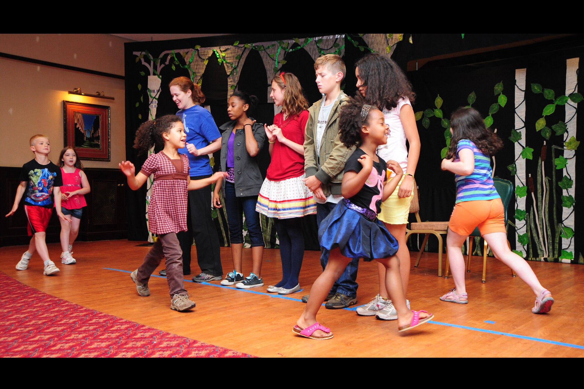 RAF MENWITH HILL, United Kingdom - Fifty-four children from the Menwith Hill community, throughout the Menwith Hill Station Youth Programs, took part in the performance of the play, “The Frog Prince,” Aug. 9 in the club ballroom. The play, which was put on by The Missoula Children’s Theater, was a culmination of a week of hard work and rehearsal for everyone involved. The theatre comes to base every summer to mesmerize a new batch of young actors and actresses. (U.S. Air Force photos by Staff Sgt. Debbie Lockhart)