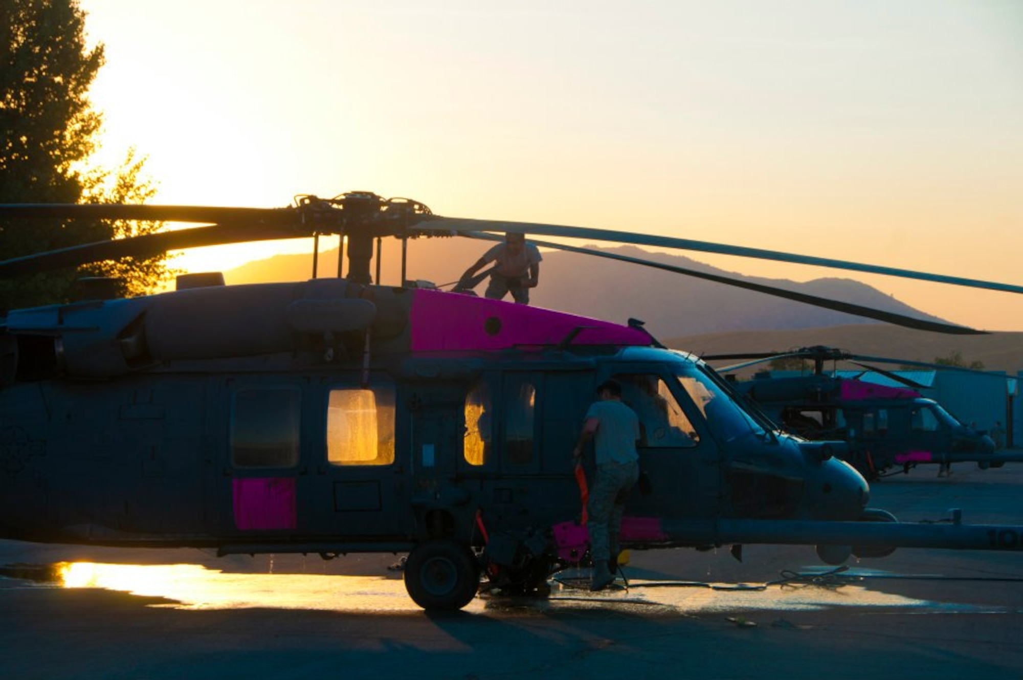 Two HH-60G Pave Hawk helicopters from the 129th Rescue Wing are battling the Jawbone Complex Fire in Kern County, Calif. The aircraft have been based out of the Tehachapi Municipal Airport in Tehachapi, Calif. since Sunday, Aug. 12. (Air National Guard photo/Master Sgt. Julie Avey)