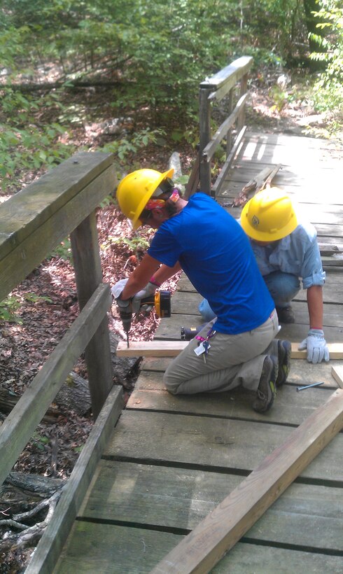 Volunteers from the Student Conservation Association work on the Overlook Trail at Tenkiller Ferry Lake. 