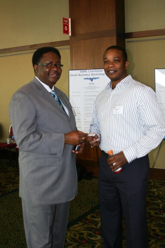 Small Business Deputy exchanging cards with prospective contractor