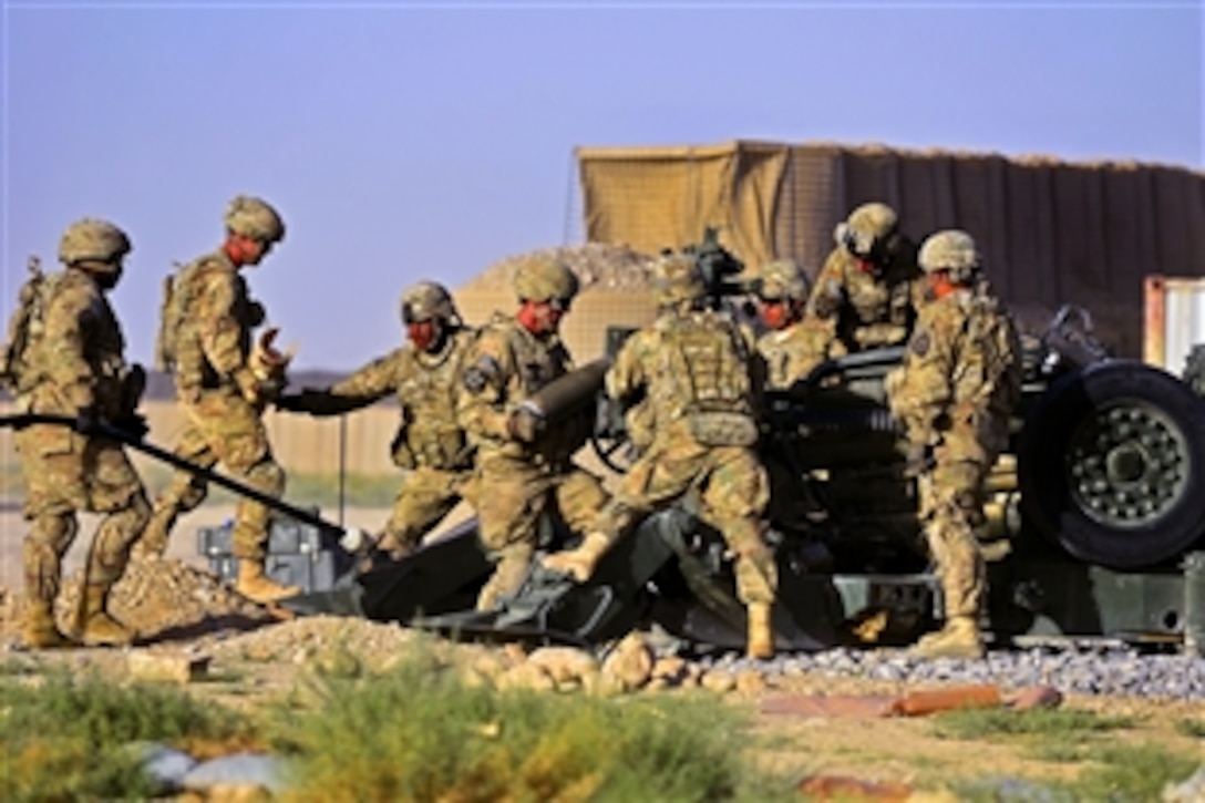 U.S. Army soldiers load a 155 mm artillery shell into an M777 howitzer on Forward Operating Base Al Masaak in southern Afghanistan, Aug. 21, 2012. The soldiers are assigned to the 2nd Infantry Division's Charlie Battery, 1st Battalion, 37th Field Artillery Regiment, 3rd Stryker Brigade Combat Team.