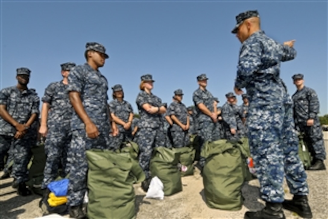 U.S. Navy staff and students at the Center for Information Dominance on Corry Station in Pensacola, Fla., prepare for Tropical Storm Isaac by packing a sea bag for five days, Aug. 26, 2012. The last major storm to affect northwest Florida was Hurricane Dennis, which made landfall near Pensacola, July 10, 2005.