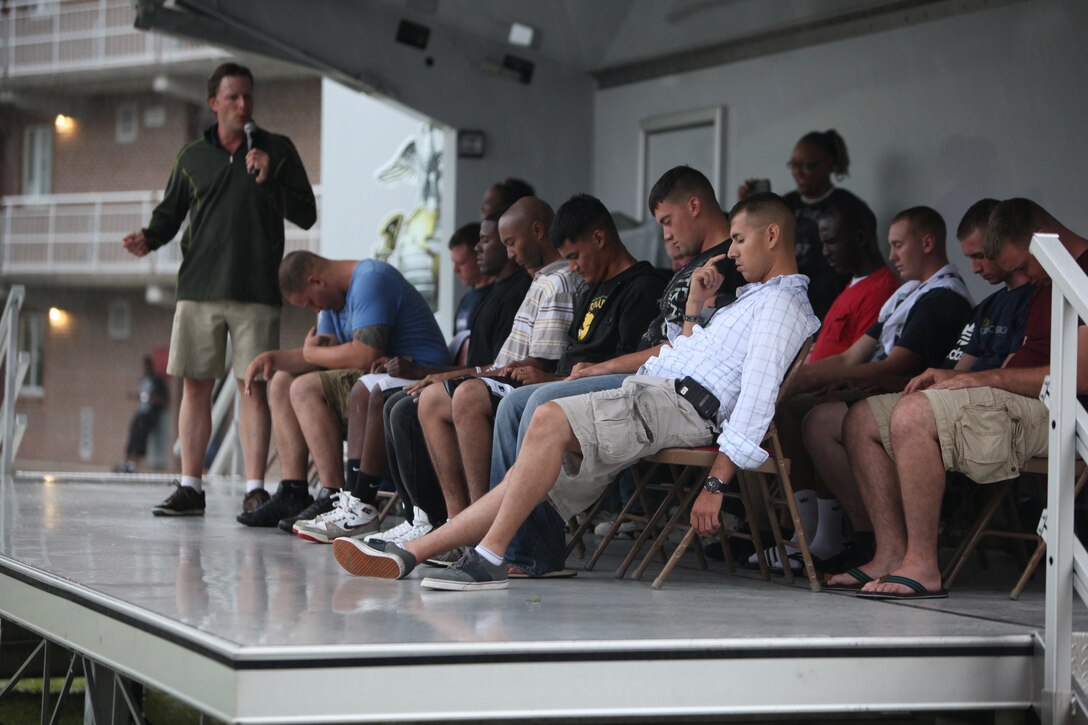 A group of Marines and sailors with 2nd Marine Logistics Group are hypnotized during a barracks bash aboard Camp Lejeune, N.C., Aug. 22, 2012. After the tournament, servicemembers enjoyed bouncy houses, rock climbing, sumo wrestling, tug-of-war and a hypnotism show.  The participants also had the opportunity to purchase tickets for raffles to win gift cards, a TV, a DVD player and two bicycles throughout the event.