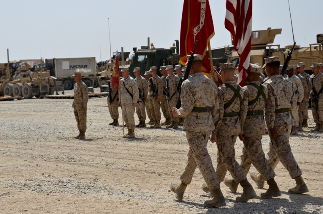 The Combat Logistics Battalion 4, 1st Marine Logistics Group (Forward) color guard marches on the colors at the transfer of authority ceremony here Aug. 14. CLB-4 transferred responsibilities as the Regimental Combat Team 6 direct support battalion to CLB-2, 1st MLG (Fwd) during the ceremony.