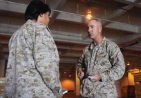 Maj. Gen. Charles L. Hudson speaks with 1st Lt. Heather R. Waldorf during a visit to Camp Kinser Aug. 21. Hudson is the commanding general of Marine Corps Logistics Command. Waldorf is a ground supply officer with 3rd Supply Battalion, Combat Logistics Regiment 35, 3rd Marine Logistics Group, III Marine Expeditionary Force. 