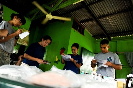 Air Force Tech. Sgt. Jennifer Nieves, Medical Element NCO in charge of Laboratory Services and Staff Sgt. Thoney Douangnoy, NCO in charge of MEDEL’s pharmacy, work together with members of Costa Rica’s Social Services to deliver prescription medicine to local patients. Together with Costa Rica’s Ministry of Health and Social Services, JTF-Bravo delivered medical care to 704 patients during a two-day joint Medical Readiness Training Exercise.