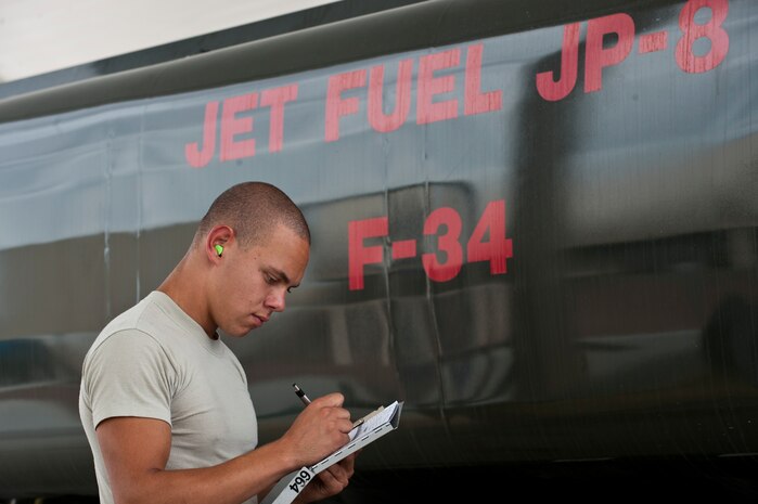 Airman 1st Class Brandon Lewis, 99th Logistics Readiness Squadron fuels distribution operator journeyman, fills out a checklist prior to refilling his truck Aug. 22, 2012, at Nellis Air Force Base, Nev. R-11 fuel tanks hold a maximum capacity of 6,000 gallons of fuel. (U.S. Air Force photo by Airman 1st Class Jason Couillard)