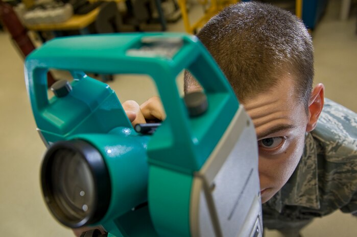 Senior Airman Joseph Harris, 57th Maintenance Group Precision Measurement Equipment Laboratory journeyman, uses a Digital Theodolite to align the weapon system for a F-15 or F-16 during a Logistics Compliance Assessment Program inspection Aug. 24, 2012, at Nellis Air Force Base, Nev. The LCAP inspection is administered at least once every two years.(U.S. Air Force photo by Airman 1st Class Daniel Hughes)