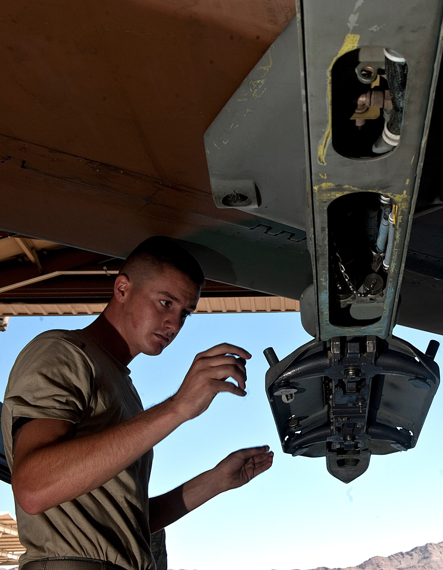 Airman 1st Class David Blyzes, 57th Maintenance Group weapons crew member, is evaluated during Logistics Compliance Assessment Program training Aug. 27, 2012, at Nellis Air Force Base, Nev. The purpose of an LCAP inspection is to provide leadership at all levels an evaluation of a unit's ability to perform key logistics processes in a safe, standardized, repeatable, and technically compliant manner. (U.S. Air Force photo by Staff Sgt. Christopher Hubenthal)
