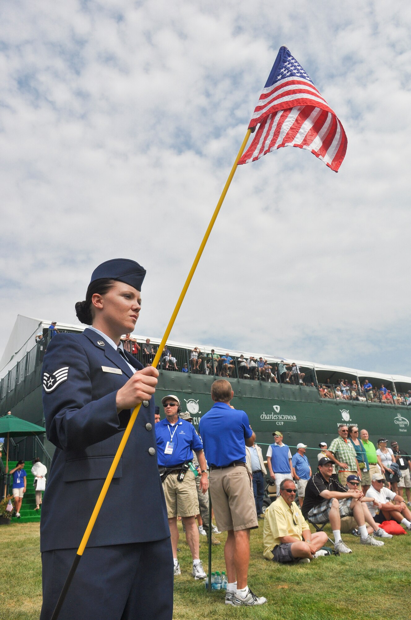 Staff Sgt. Valerie Parra, a jet engine mechanic from the 62nd Aircraft Maintenance Squadron, Joint Base Lewis-McChord, Wash., tends the flag Aug. 26, 2012, off the 18th green of Tournament Player's Club Snoqualmie Ridge golf course in Snoqualmie, Wash. Parra was one of ten U.S. service members selected to perform duties as honorary tee callers and 18th hole flag pullers during Military Appreciation Day at the Boeing Classic tournament held at the course. (U.S. Air Force photo/Staff Sgt. Sean Tobin)