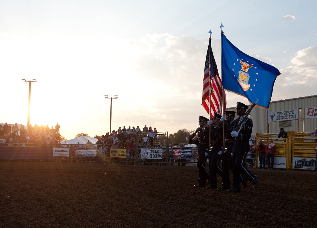 Members of the Ellsworth Air Force Base Honor Guard present the colors during an opening ceremony for the Range Days Rodeo at the Central States Fairgrounds in Rapid City, S.D., Aug. 23, 2012. The Pig Roast & Military Appreciation Event allows Ellsworth’s community partners to honor the military for their dedication to our nation. (U.S. Air Force photo by Airman 1st Class Alystria Maurer/Released)