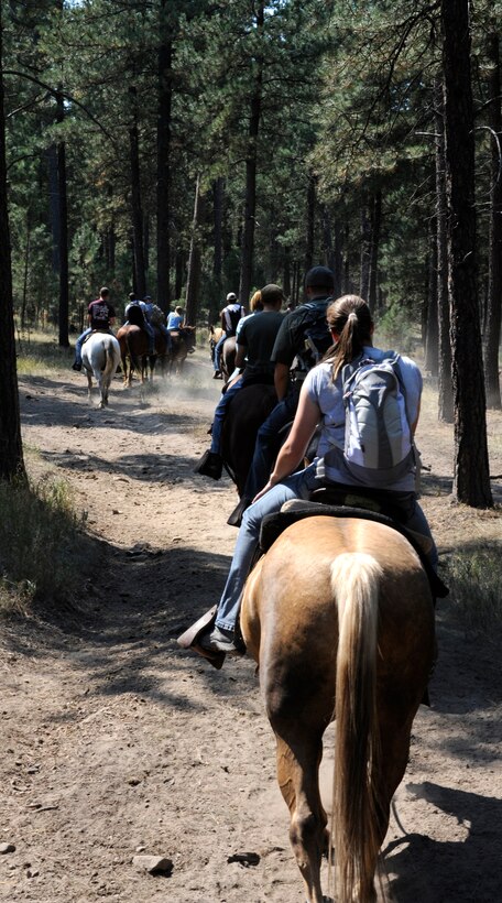 Airmen from Ellsworth ride horseback through Custer State Park during a trip organized by the 28th Force Support Squadron Outdoor Recreation office in Custer, S.D., Aug. 26, 2012. The two-hour trail ride offered scenic views through hills and wooded areas, and is one of many events Outdoor Recreation schedules to provide Airmen opportunities to enjoy the local area. (U.S. Air Force photo by Airman Ashley J. Woolridge/Released)