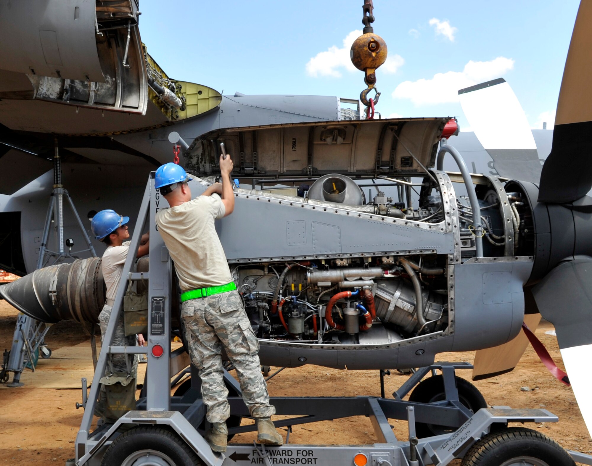 The 19th Aircraft Maintenance Squadron and the 19th Component Maintenance Squadron prepare a turboprop to be attached to a C-130E Aug, 28, 2012, at Jacksonville, Ark. The installation of a turboprop takes approximately six hours to complete. (U.S. Air Force photo by Staff Sgt. Caleb Pierce)