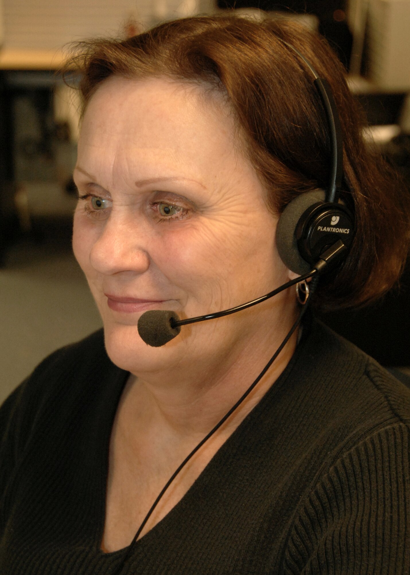 Lucetta Miles, Travis Air Force Base telephone operator, locates a phone number for a customer at the new Consolidated Telephone Operator Center at Travis AFB, Calif. Beginning Sept. 7, 2012, operators at Travis AFB will handle all incoming calls to Ellsworth AFB, S.D., in accordance with an initiative by Air Combat Command to consolidate the major command?s base switchboards to two locations. (U.S. Air Force courtesy photo by Nan Wylie)