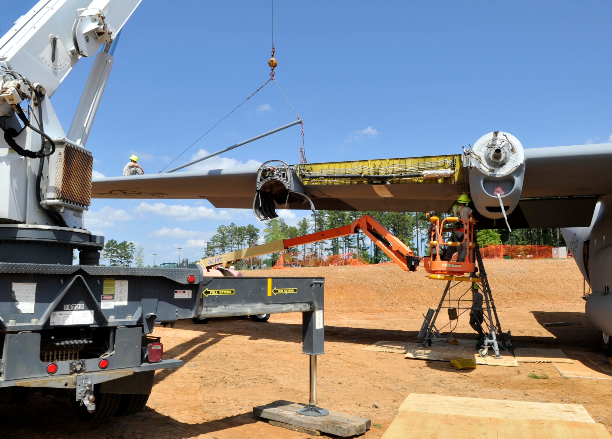 A  wing is attached to a C-130E Aug. 28, 2012, at Jacksonville, Ark. The C-130 is being reassembled in front of the Little Rock Air Force Base - City of Jacksonville Joint Education Center for a static display. (U.S. Air Force photo by Staff Sgt. Caleb Pierce) 