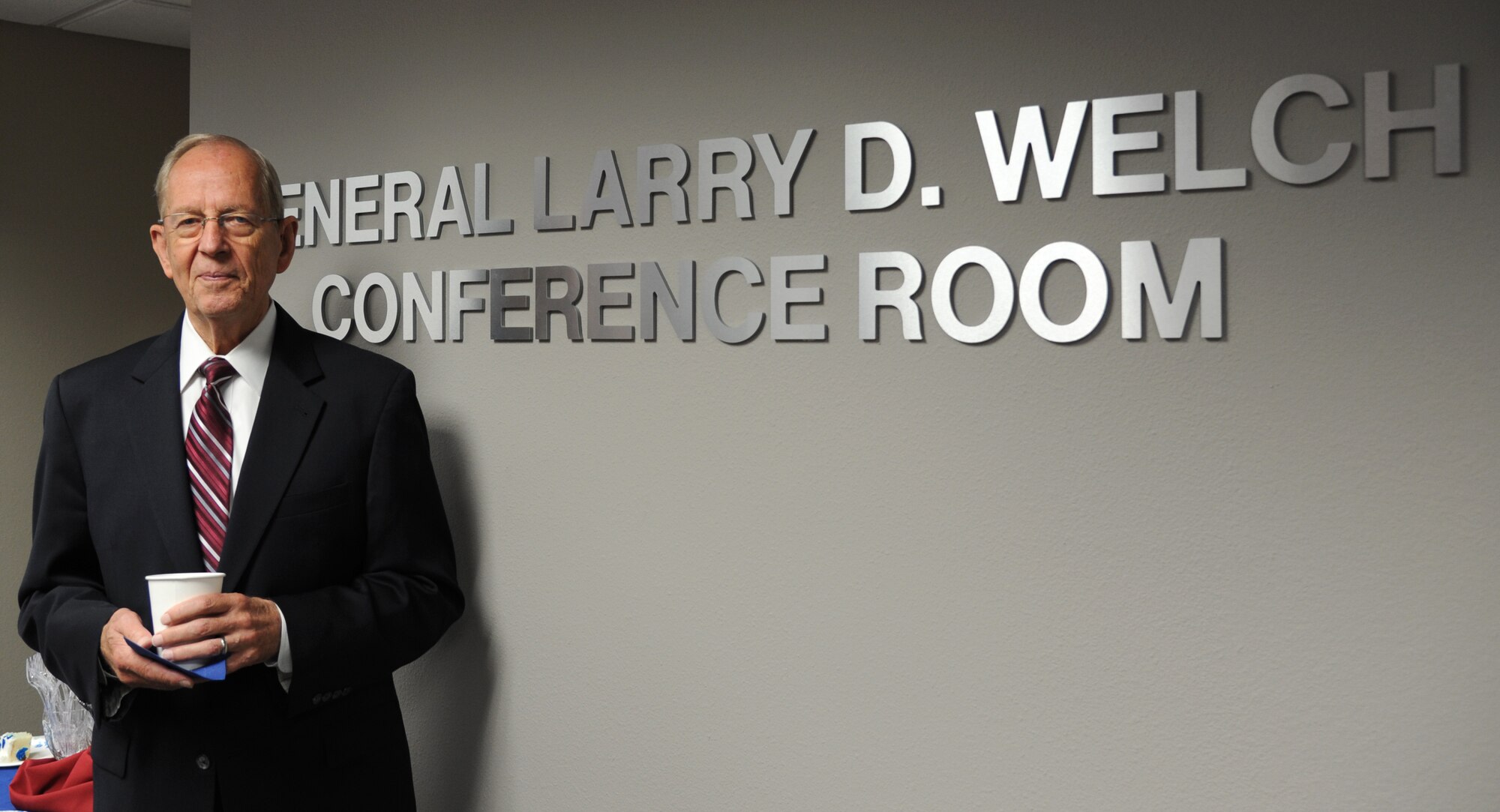 Gen. (retired) Larry D. Welch poses in the conference room dedicated to him at Air Force Global Strike Command headquarters on Barksdale Air Force Base, La., Aug. 27. (U.S. Air Force photo/Airman 1st Class Joseph A. Pagán Jr.)