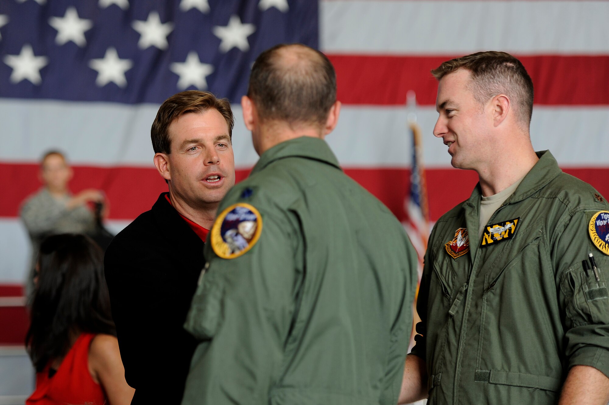 Dr. Steven Lauzon; a Sumter Surgical partner, (left), talks with pilots assigned to the 20th Fighter Wing after assuming honorary command during an honorary commander assumption of command ceremony, Aug. 24, 2012, Shaw Air Force Base, S.C. Lauzon assumed the honorary commander position for the 77th FS. Lauzon has been a longtime supporter of Team Shaw and the 77th FS. The honorary commander program is designed to educate those in the community with limited knowledge of the Air Force and the operations that happen on Shaw. (U.S. Air Force photo by Senior Airman Kenny Holston/Released)