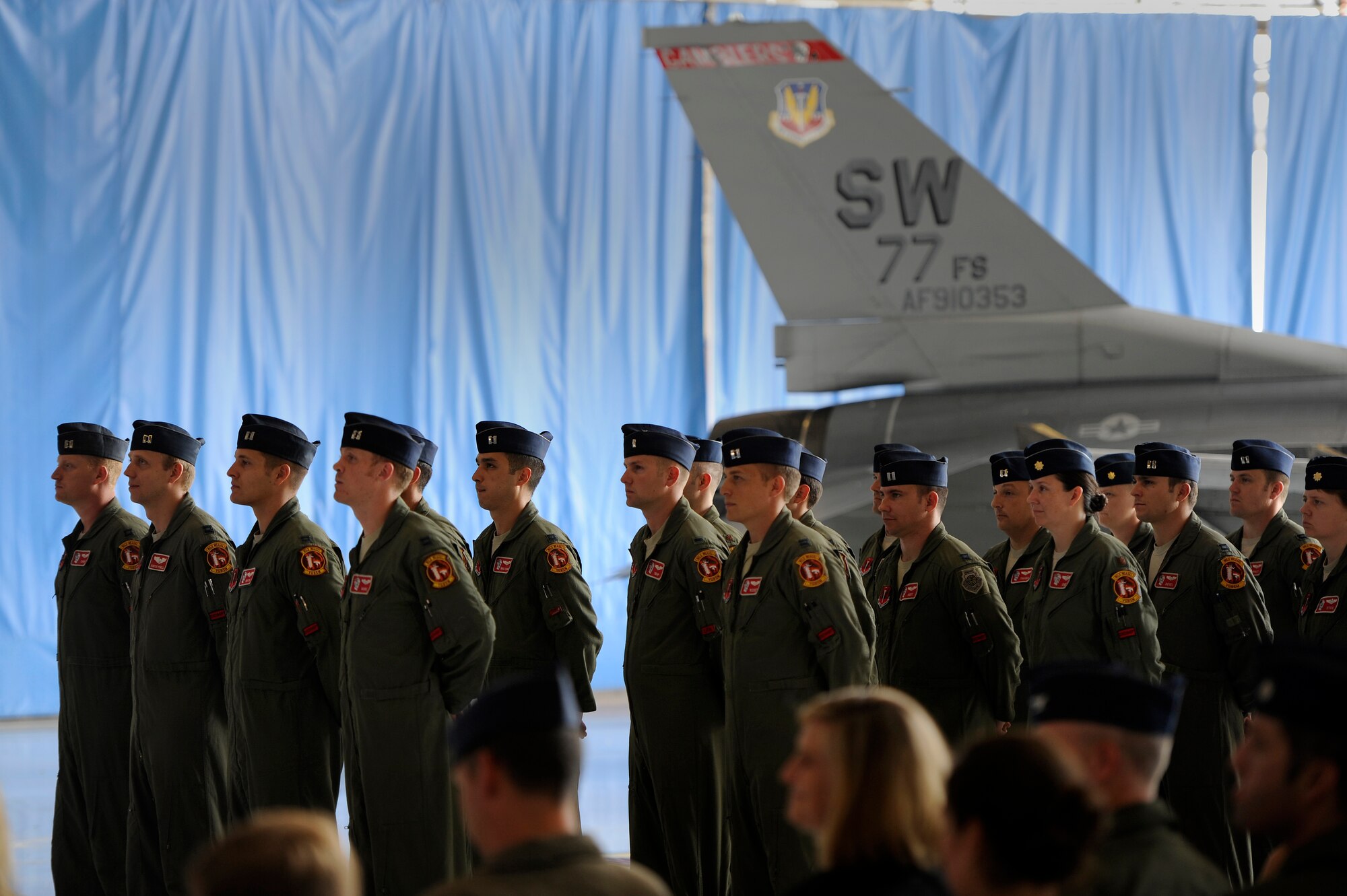 U.S. Air Force fighter pilots assigned to the 77th Fighter Squadron stand in formation during an honorary commander assumption of command ceremony, Aug. 24, 2012, Shaw Air Force Base, S.C. Dr. Steven Lauzon; a Sumter Surgical partner assumed the honorary commander position for the 77th FS. Lauzon has been a longtime supporter of Team Shaw and the 77th FS. The honorary commander program is designed to educate those in the community with limited knowledge of the Air Force and the operations that happen on Shaw. (U.S. Air Force photo by Senior Airman Kenny Holston/Released)