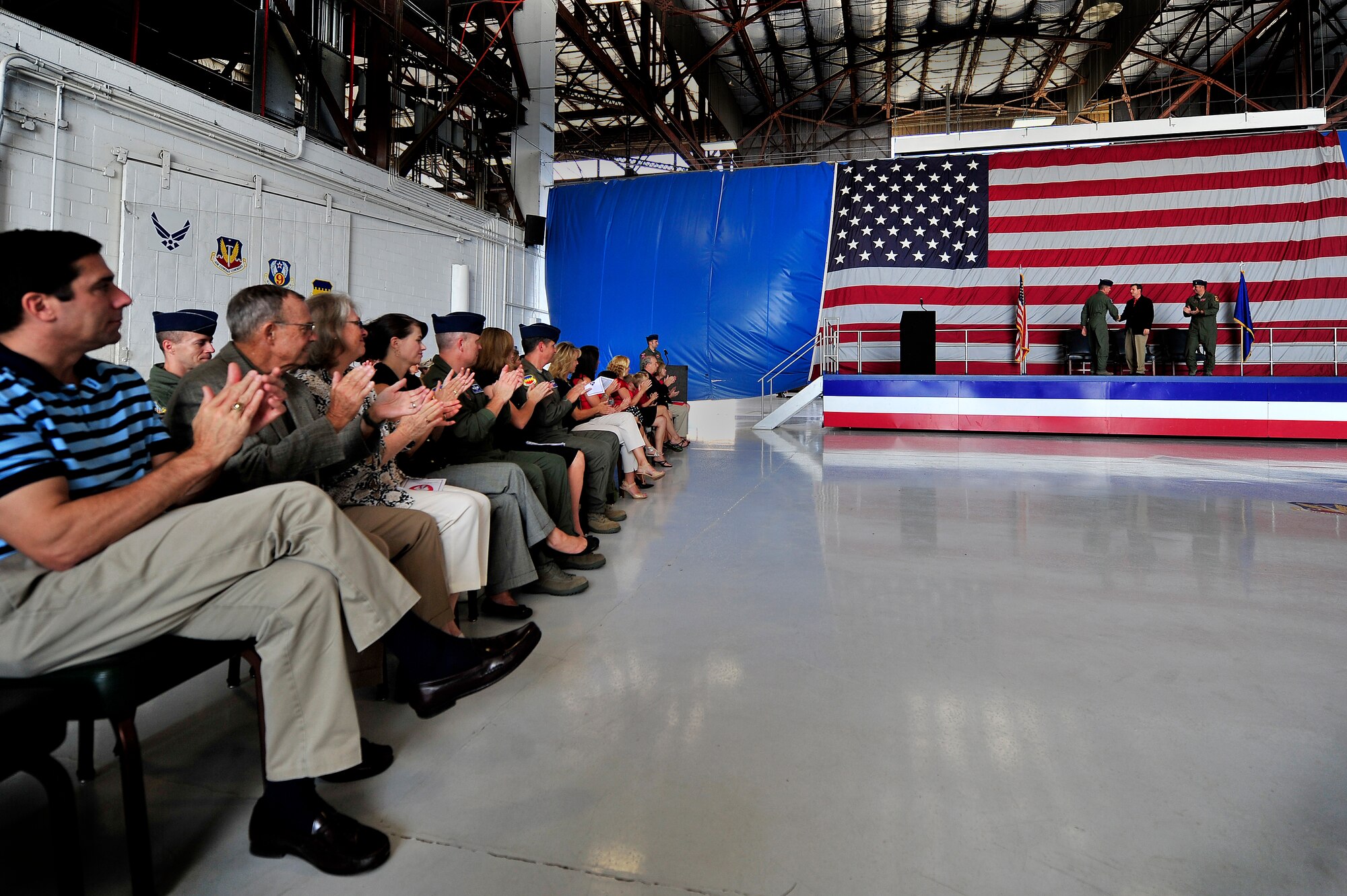 All in attendance at the 77th Fighter Squadron, honorary commander assumption of command ceremony applaud as Dr. Steven Lauzon; a Sumter Surgical partner assumes honorary command of the 77th Fighter Squadron, Aug. 24, 2012, Shaw Air Force Base, S.C. Lauzon has been a longtime supporter of Team Shaw and the 77th FS. The honorary commander program is designed to educate those in the community with limited knowledge of the Air Force and the operations that happen on Shaw. (U.S. Air Force photo by Senior Airman Kenny Holston/Released)