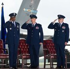 Lt. Gen. Darren McDew, left, 18th Air Force commander, receives salutes from Col. Mark Camerer and Col. Richard Moore, Jr., during the 436th Airlift Wing change of command ceremony August 27, 2012, in Hangar 706 at Dover Air Force Base, Del. Camerer relinquished command of the wing to Moore during the ceremony. (U.S. Air Force photo by Roland Balik)