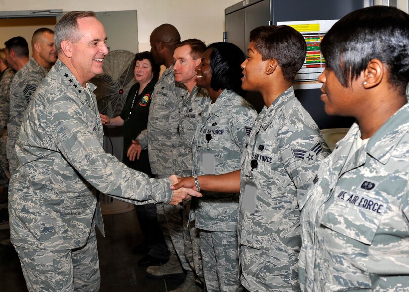 Air Force Chief of Staff Gen. Mark A. Welsh III greets Senior Airman Tylisha Darling, Air Force Mortuary Affairs Operations, Aug. 22, 2012, at The Charles C. Carson Center for Mortuary Affairs at Dover Air Force Base, Del. Welsh visited AFMAO and toured the Center for the Families of the Fallen and the Fisher House for Families of the Fallen to see how the men and women perform the sacred mission of providing dignity, honor and respect for the fallen and care, service and support for the families. (U.S. Air Force photo/Tech. Sgt. Chuck Walker) 