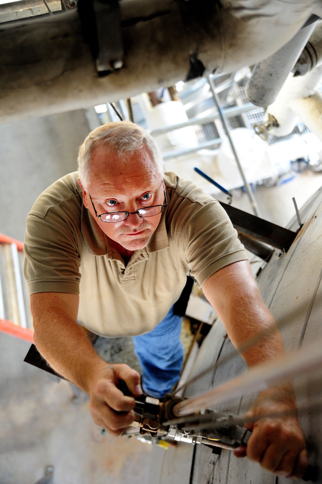 WHITEMAN AIR FORCE BASE, Mo. -- Paul Ross, 509th Civil Engineer Squadron central heat plant project manager, inspects sight glasses on a condensate receiver tank, Aug. 27. The purpose of the inspection is to ensure the receiver tank is mission capable for continual use. (U.S. Air Force photo/Senior Airman Nick Wilson) (Released)