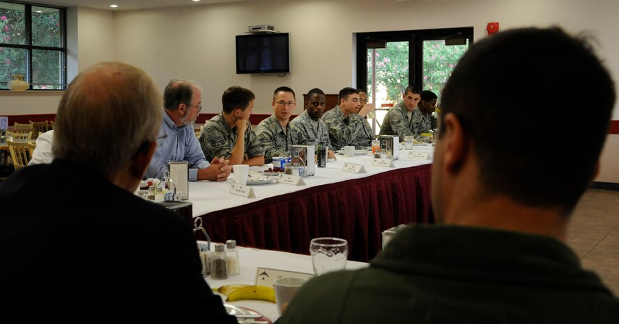 Senior Airman Jerald Delia (center), 2nd Aircraft Maintenance Squadron, speaks with retired Air Force General Larry Welch, 12th Chief of Staff of the Air Force, and Col. Andrew Gebara, 2nd Bomb Wing commander at the defense breakfast on Barksdale Air Force Base, La., Aug. 28. Airmen were invited to the breakfast to meet with Welch and discuss work-related issues and possible solutions. (U.S. Air Force photo/Airman 1st Class Andrew Moua)(RELEASED)
