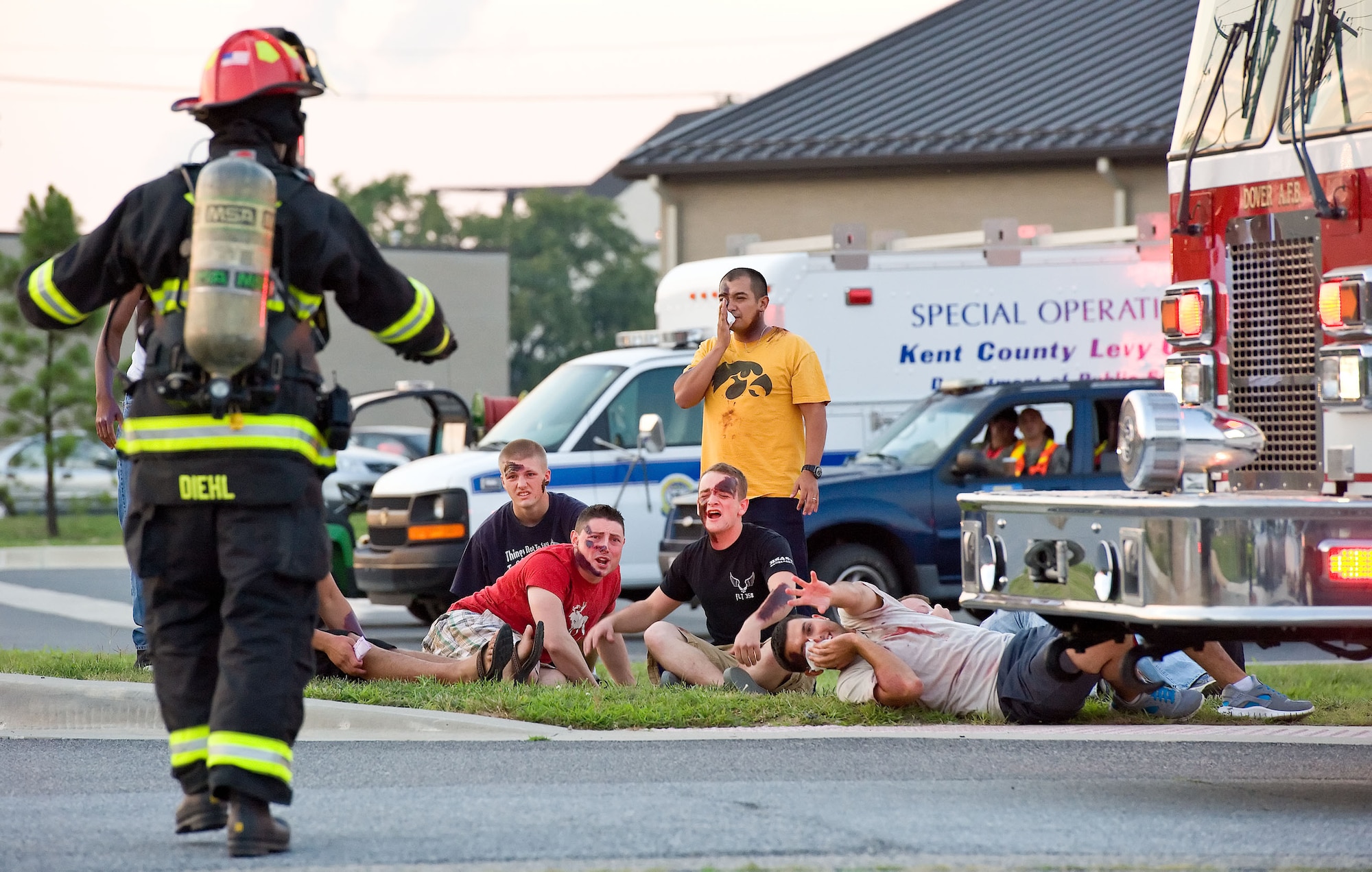 Staff Sgt. Chad Diehl, a firefighter with the 436th Civil Engineer Squadron Fire Department, approaches simulated victims Aug. 21, 2012, at Dover Air Force Base, Del. A simulated explosion at the base theater was part of the Aug. 20-22 Major Accident Response Exercise, held to test Team Dover?s ability to respond to threats and emergencies. Dover AFB partnered with members of the local community during the MARE to strengthen cooperation and communication between agencies. (U.S. Air Force photo by Roland Balik)