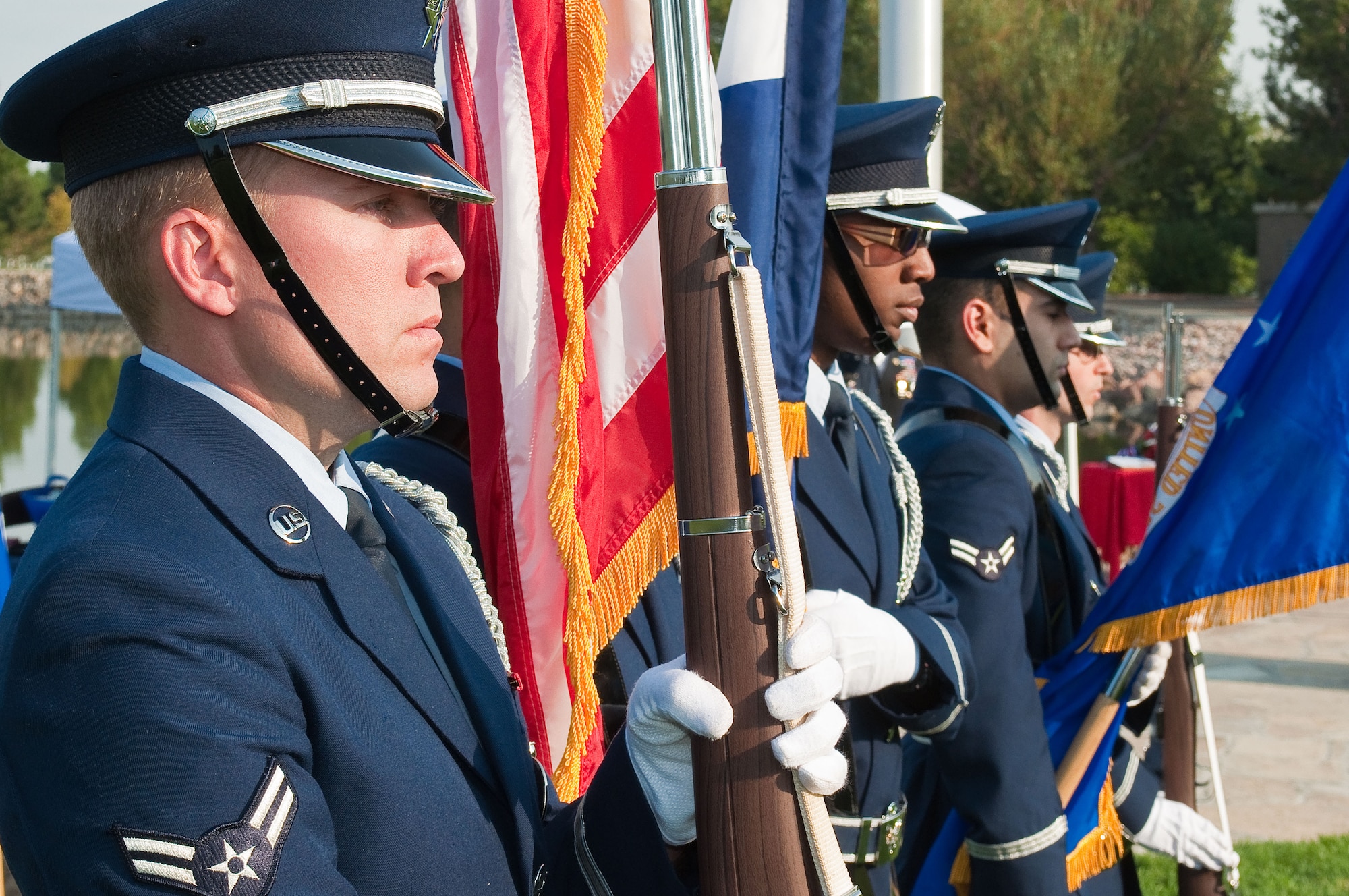 The 460th Space Wing Color Guard posts the colors for the ceremony to present the Prisoner of War Medal to retired Master Sgt. James O’Neal Hughes at Fort Logan National Cemetery, Denver, Colo.,  Aug. 22, 2012. On Nov. 4, 1979, then-Staff Sgt. Hughes was taken hostage along with 65 other Americans at the U.S. Embassy in Tehran, Iran, by a group of Iranian students. (Air National Guard photo/Capt. Darin Overstreet)
