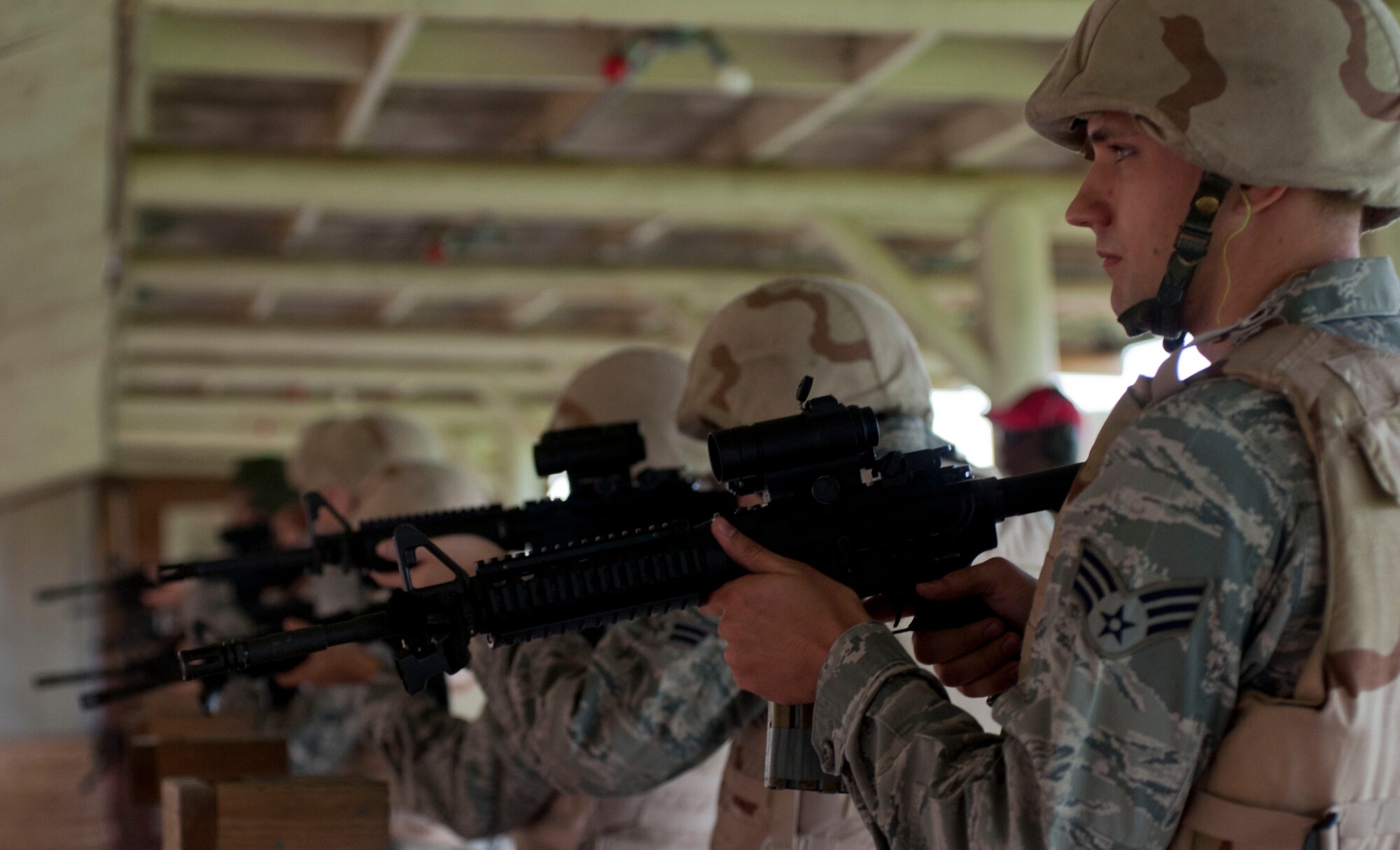 U.S. Air Force Senior Airman Josh Johnson, 633rd Communications Squadron cyber transport technician, readies his M-4 Carbine during the Combat Arms course at Langley Air Force Base, Va., Aug. 28, 2012. The course is designed to teach tactical movements and positions, which promote safety in weapon use. (U.S. Air Force photo by Senior Airman Stephanie Rubi/Released)