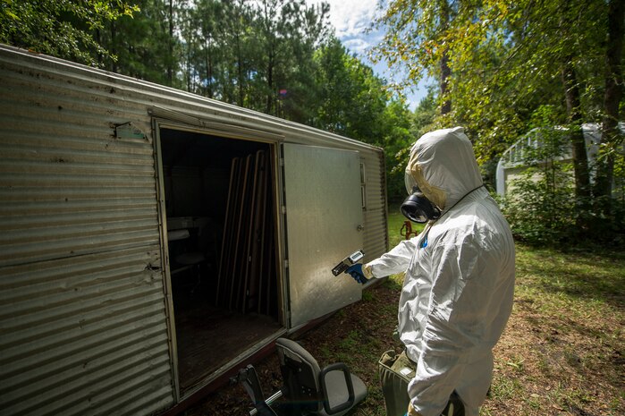 Senior Airman Nathan Pringle, 628th Civil Engineer Squadron emergency manager, operates an ADM-300 radiation detector during training exercise Operation Burnt Spear Aug. 24, 2012, at Joint Base Charleston, S.C. Emergency managers performed radiological response training for a simulated incident involving a dirty bomb. In the scenario, a mock Federal Bureau of Investigation Joint Task Force requested Air Force Emergency Management assistance to verify and contain any radiation present from the device and establish a communication hotline for incoming responders. (U.S. Air Force photo by Airman 1st Class George Goslin)