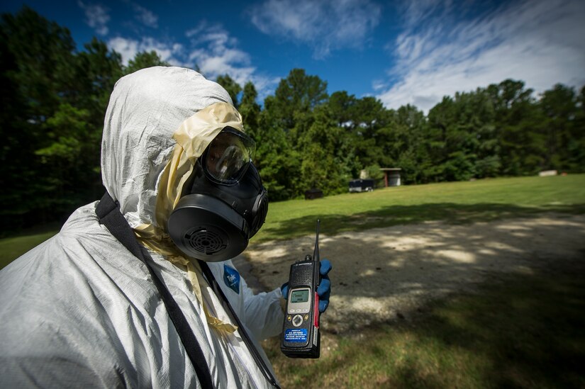 Airman 1st Class William Workman, 628th Civil Engineer Squadron emergency manager, communicates with headquarters during training exercise Operation Burnt Spear Aug. 24, 2012, at Joint Base Charleston, S.C. The emergency managers performed radiological response training for a simulated incident involving a dirty bomb. In the scenario, a mock Federal Bureau of Investigation Joint Task Force requested Air Force Emergency Management assistance to verify and contain any radiation present from the device and establish a communication hotline for incoming responders. (U.S. Air Force photo by Airman 1st Class George Goslin)