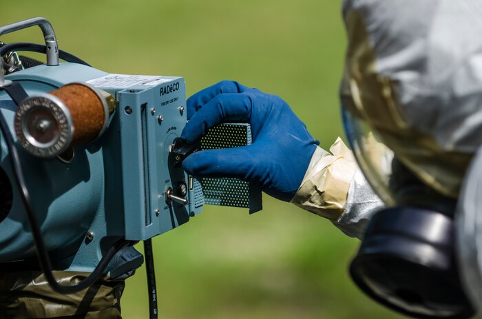 Senior Airman Nathan Pringle, 628th Civil Engineer Squadron emergency manager, operates a Radeco air sampler during training exercise Operation Burnt Spear Aug. 24, 2012, at Joint Base Charleston, S.C. The emergency managers performed radiological response training for a simulated incident involving a dirty bomb. In the scenario, a mock Federal Bureau of Investigation Joint Task Force requested Air Force Emergency Management assistance to verify and contain any radiation present from the device and establish a communication hotline for incoming responders. (U.S. Air Force photo by Airman 1st Class George Goslin)