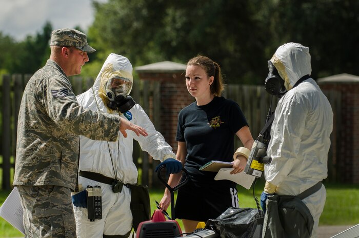 Staff Sgt. Brandon Barnes, 628th Civil Engineer Squadron emergency manager, briefs Senior Airman Nathan Pringle, Airman 1st Class William Workman and Michelle Bates, 628th Civil Engineer Squadron emergency managers, during training exercise Operation Burnt Spear Aug. 24, 2012, at Joint Base Charleston, S.C. The emergency managers conducted radiological response training for a simulated incident involving a dirty bomb. In the scenario, a mock Federal Bureau of Investigation Joint Task Force requested Air Force Emergency Management assistance to verify and contain any radiation present from the device and establish a communication hotline for incoming responders. (U.S. Air Force photo by Airman 1st Class George Goslin)