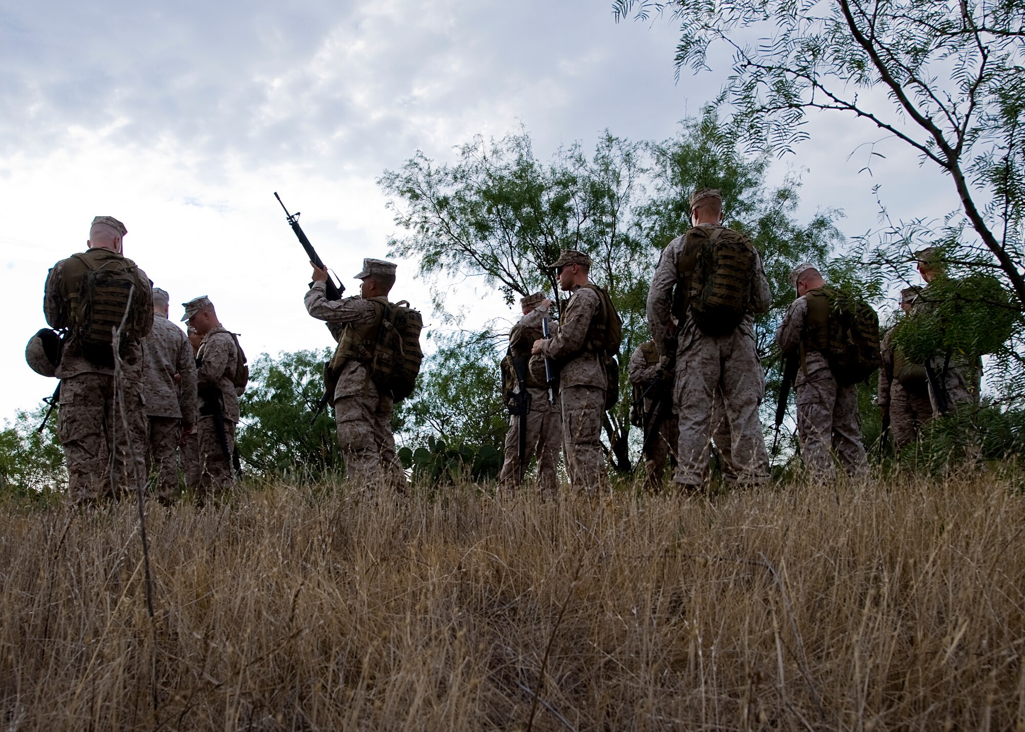 Marines take part in the operations culminating portion of the Corporal’s Course Aug. 24, 2012, at Dyess Air Force Base, Texas. The Corporals Course is a two-week program focused on providing the skills necessary to lead Marines and is designed to provide the war fighting skill, core values and mindset necessary for effective leadership of a team and subordinate Marines. Upon completion, corporals have the skills necessary to clearly articulate one’s thoughts in both oral and written communications; understand the standards of leadership traits, principles and fundamentals; understand the NCO mindset of "doing instead of knowing;" and execute and apply tactical measures at the team level. (U.S. Air Force photo by Airman 1st Class Damon Kasberg/Released)