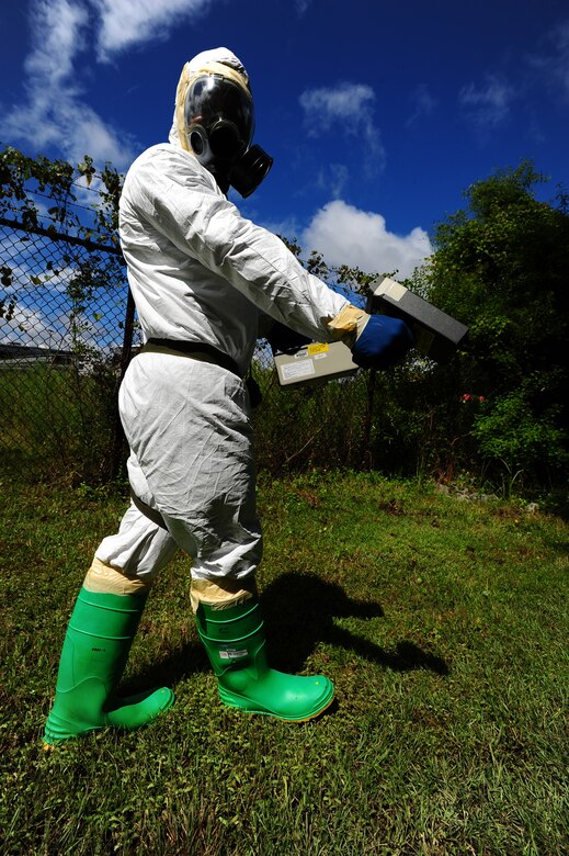 Senior Airman Nathan Pringle, 628th Civil Engineer Squadron emergency manager, checks for radiation during training exercise Operation Burnt Spear Aug. 24, 2012, at Joint Base Charleston, S.C. The emergency managers conducted radiological response training for a simulated incident involving a dirty bomb. In the scenario, a mock Federal Bureau of Investigation Joint Task Force requested Air Force Emergency Management assistance to verify and contain any radiation present from the device and establish a communication hotline for incoming responders. (U.S. Air Force photo/ Airman 1st Class Chacarra Walker)