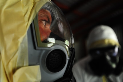 Senior Airman Nathan Pringle, 628th Civil Engineer Squadron emergency manager, checks for radiation during training exercise Operation Burnt Spear Aug. 24, 2012, at Joint Base Charleston, S.C. The emergency managers conducted radiological response training for a simulated incident involving a dirty bomb. In the scenario, a mock Federal Bureau of Investigation Joint Task Force requested Air Force Emergency Management assistance to verify and contain any radiation present from the device and establish a communication hotline for incoming responders. (U.S. Air Force photo/ Airman 1st Class Chacarra Walker)