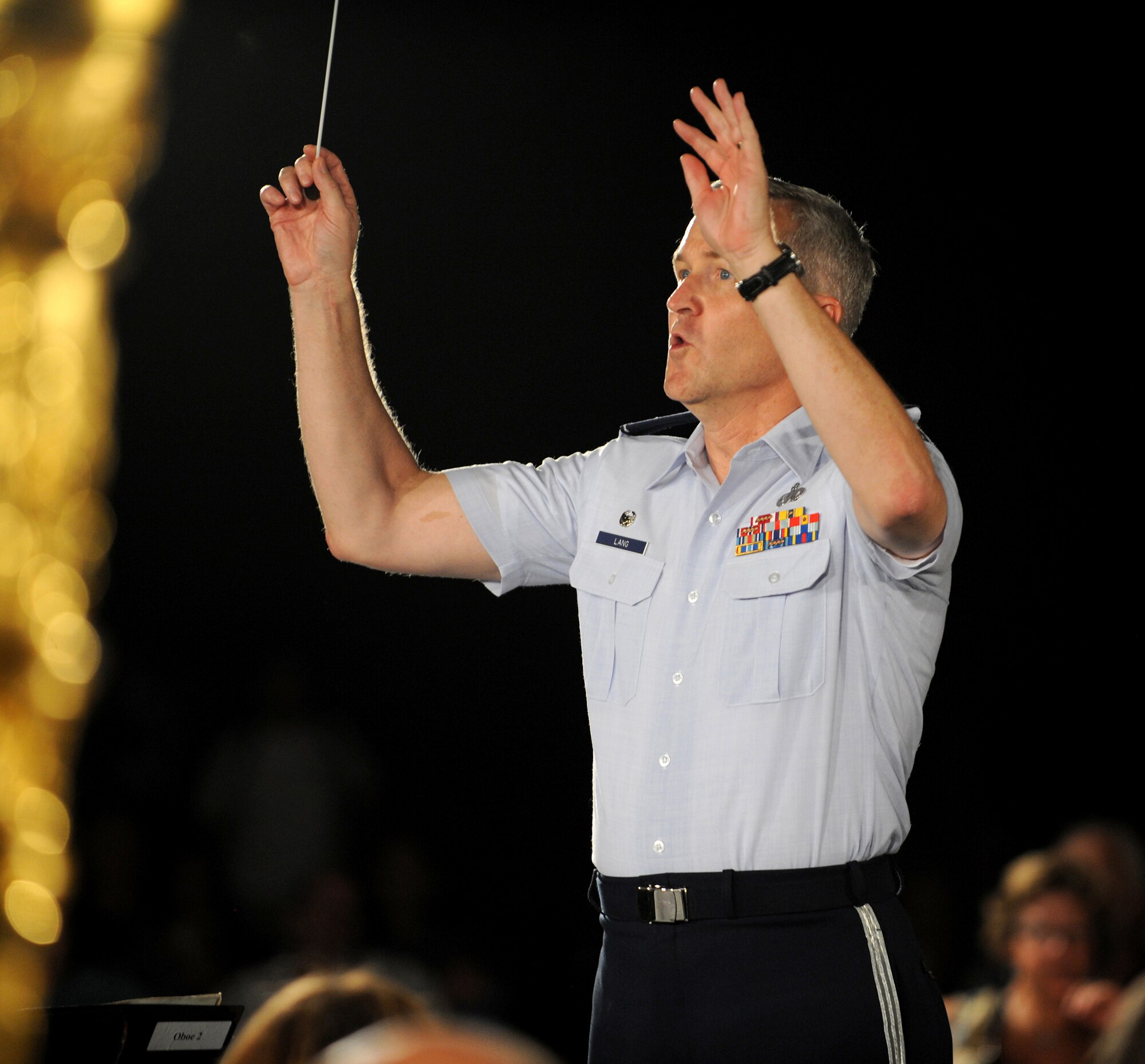 Col. Larry Lang, Commander and Conductor of the U.S. Air Force Band, conducts a concert at the Air Force Memorial on August 24, 2012 in Washington D.C. Throughout the summer months of June, July, and August, the band's performing ensembles present free outdoor concerts at historic venues in our nation's capital for Washington area residents, as well as for visitors from around the world.  (U.S. Air Force photo by Senior Airman Christina Brownlow)