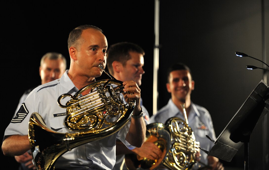 A U.S. Air Force band member plays the French horn during a concert held at the Air Force Memorial on August 24, 2012 in Washington D.C. Throughout the summer months of June, July, and August, the band's performing ensembles present free outdoor concerts at historic venues in our nation's capital for Washington area residents, as well as for visitors from around the world. (U.S. Air Force photo by Senior Airman Christina Brownlow)