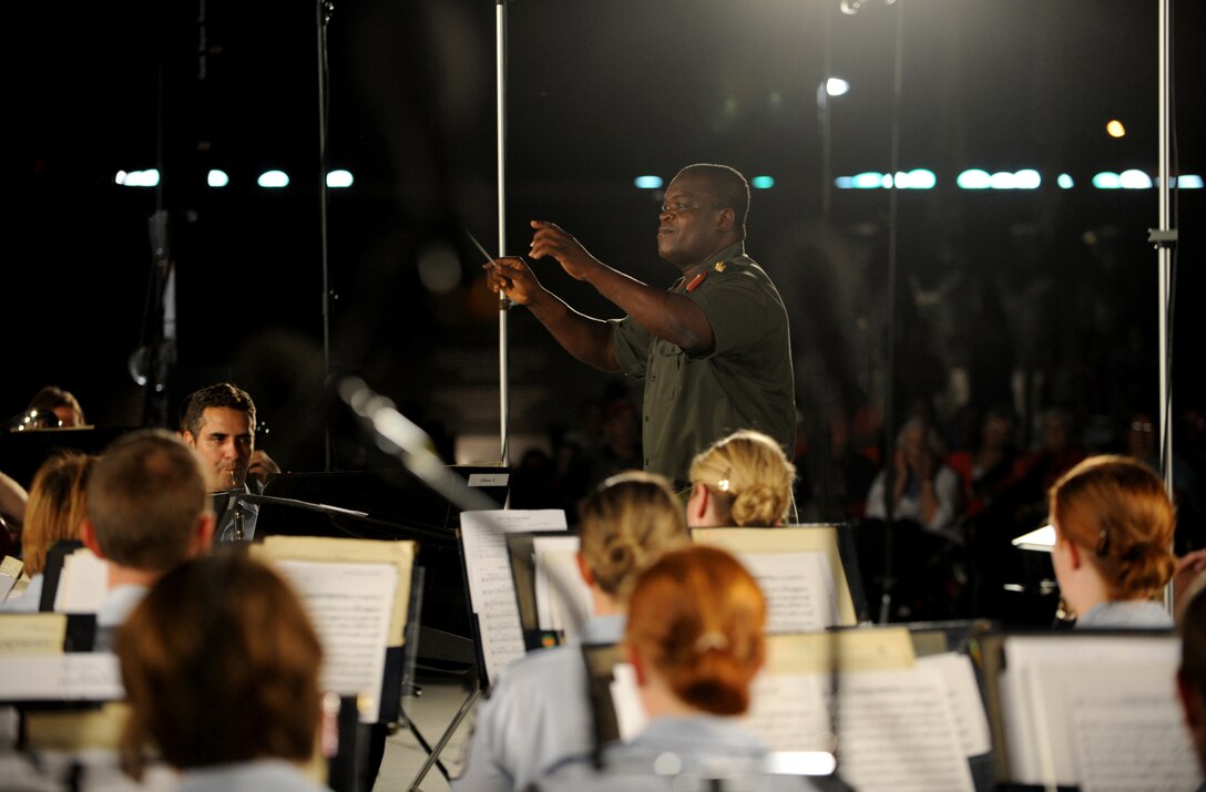 Col. Sampson Paa-Kwesi Ebonyi, director of music and bands of the Ghana armed forces, was a guest conductor for the U.S. Air Force Band as they played for bystanders at the Air Force Memorial on August 24, 2012 in Washington D.C. The USAF band hosts this concert every Tuesday from June 5-August 28, 2012. (U.S. Air Force photo by Senior Airman Christina Brownlow)