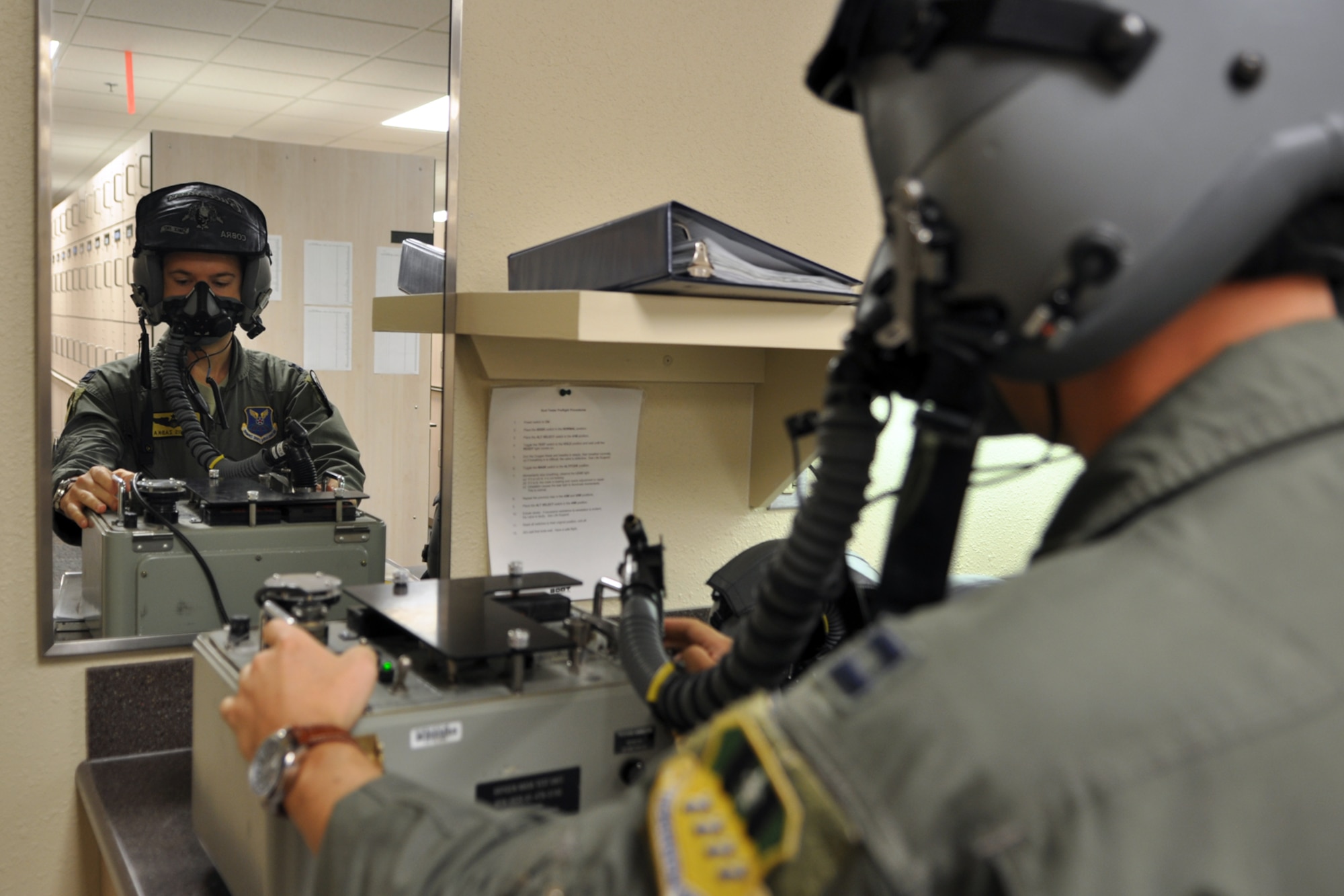 Capt. Dennis Zabka, a pilot assigned to the 11th Bomb Squadron checks his mask for leaks at Barksdale Air Force Base, La., Aug. 27, 2012. Zabka is part of the 11 BS team competing in the Global Strike Challenge. (U.S. Air Force photo by Master Sgt. Jeff Walston/Released)