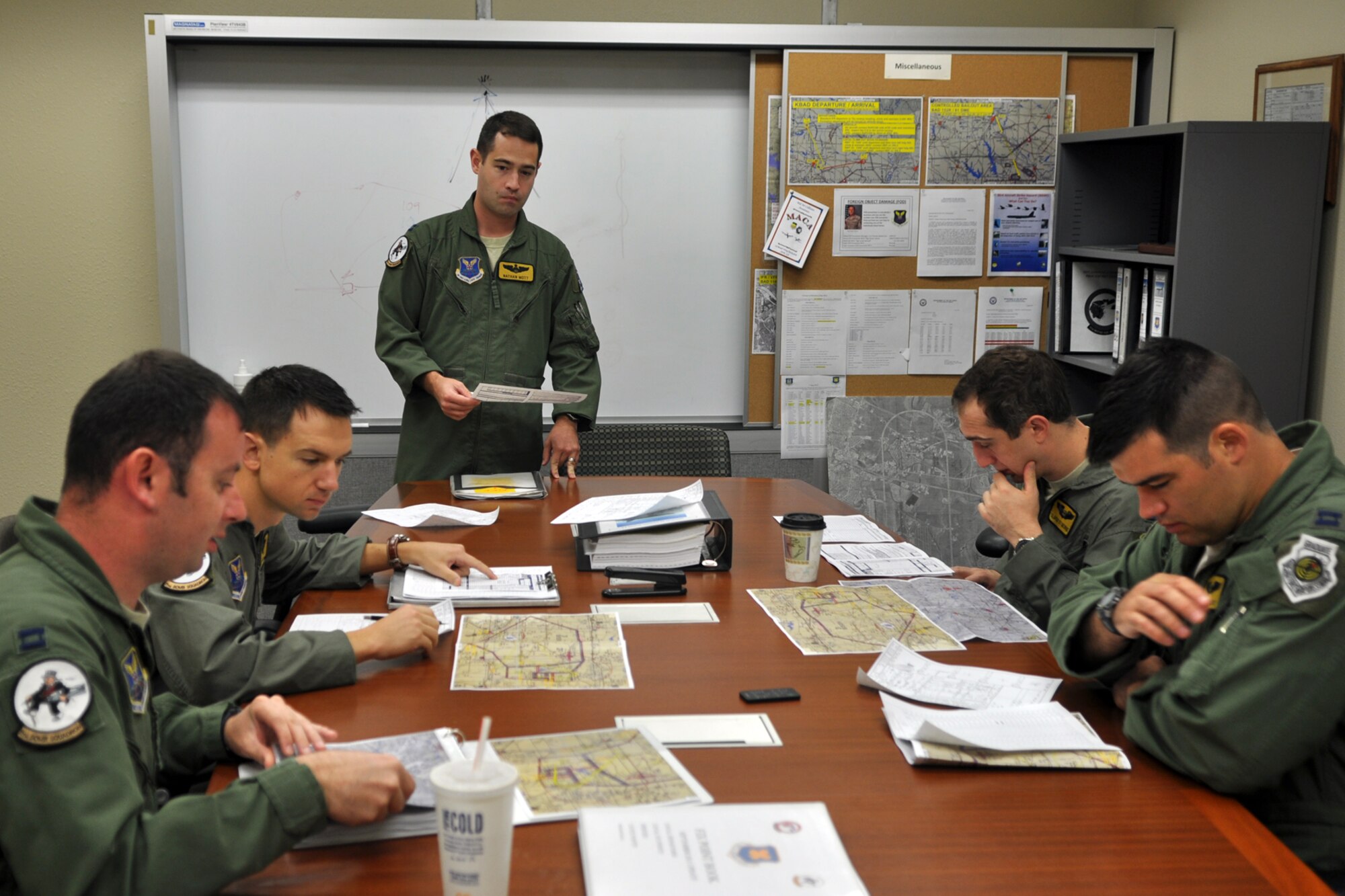 Capt. Nathan Mott, aircraft commander, conducts mission planning with Capt. Charles Shank, navigator, Capt. Dennis Zabka, pilot, Capt. Paul St. George, electronic warfare officer and Capt. Bryson Ayers, radar navigator, at Barksdale Air Force Base, La., Aug. 27, 2012. All five Airmen are assigned to the 11th Bomb Squadron at Barksdale, and were preparing to fly a sortie for the Global Strike Challenge. (U.S. Air Force photo by Master Sgt. Jeff Walston)