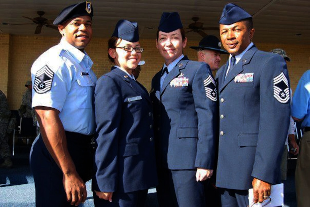 U.S. Air Force Airman 1st Class Mariah Alexander, second from left, 633rd Medical Support Squadron pharmacy technician, stands with her parents after her Basic Military Training graduation at Lackland Air Force Base, Texas, Oct. 21, 2011. All three of Alexander’s parents are retired Chief Master Sgts. (Courtesy Photo/Released)